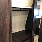 The Sanibel 3202WB customer doesn’t have to pack light with an expansive front closet, shoe storage, cubby style shelving and a curved clothing rod that sit behind large barn style doors with floor to ceiling mirrors to make getting ready easy.