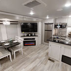 Dinette, entertainment center, and kitchen
